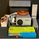 A Rollei projector, cased, some accessories; a brown leather tape measure, Rabone Chesterman,