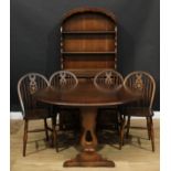 A Priory style matched dining suite, comprising dresser, 175.5cm high, 92cm wide, 41cm deep,