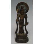 A Chinese bronze figure, cast as Guanyin, she stands, holding a bottle, lotus base, traces of