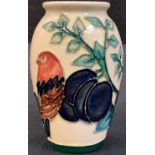 A Moorcroft Finch and Plum Tree pattern tube lined vase, 10.5cm high