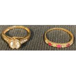 A 9ct gold dress ring, set with paste stones, size L, 2g; a similar 9ct gold dress ring set with