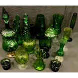 A decorative green glass vase, others similar, a vine shaped decanter, other green glass, 20th