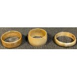 A 9ct gold wedding band, size N, 3.5g; two metal rings (3)