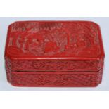 A Chinese cinnabar lacquer canted rectangular box and cover, carved in relief with figures in a