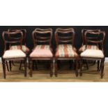 A set of eight William IV/early Victorian rosewood dining chairs, drop-in seats, lotus capped