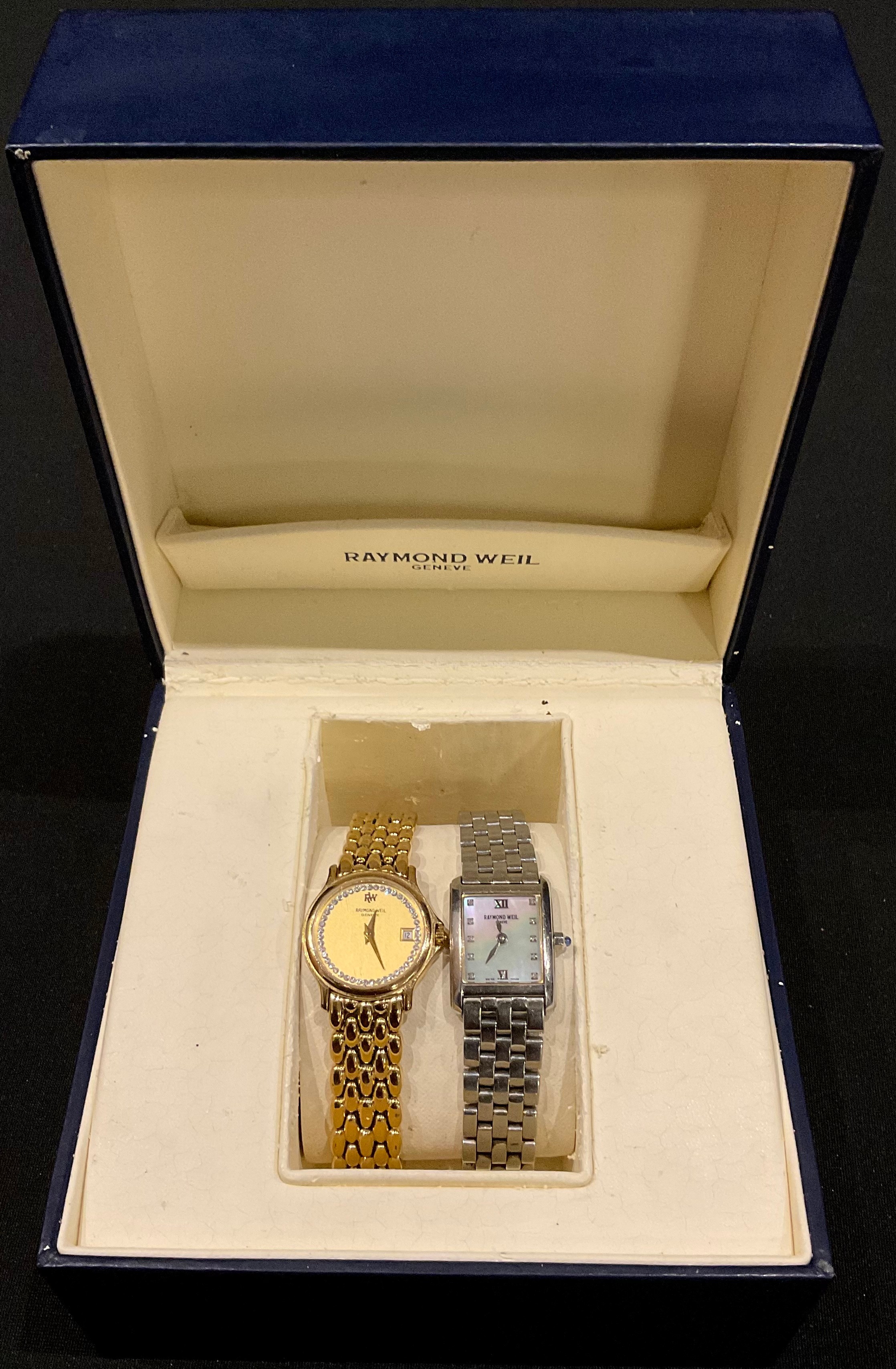 A Raymond Weil wristwatch, boxed with papers; another, similar