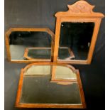 An arched rectangular mirror, 68cm x 56cm; an Edwardian mirror; others (3)