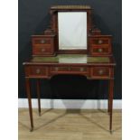 An Edwardian mahogany bonheur du jour or writing desk, the escutcheons pressed with a stylised