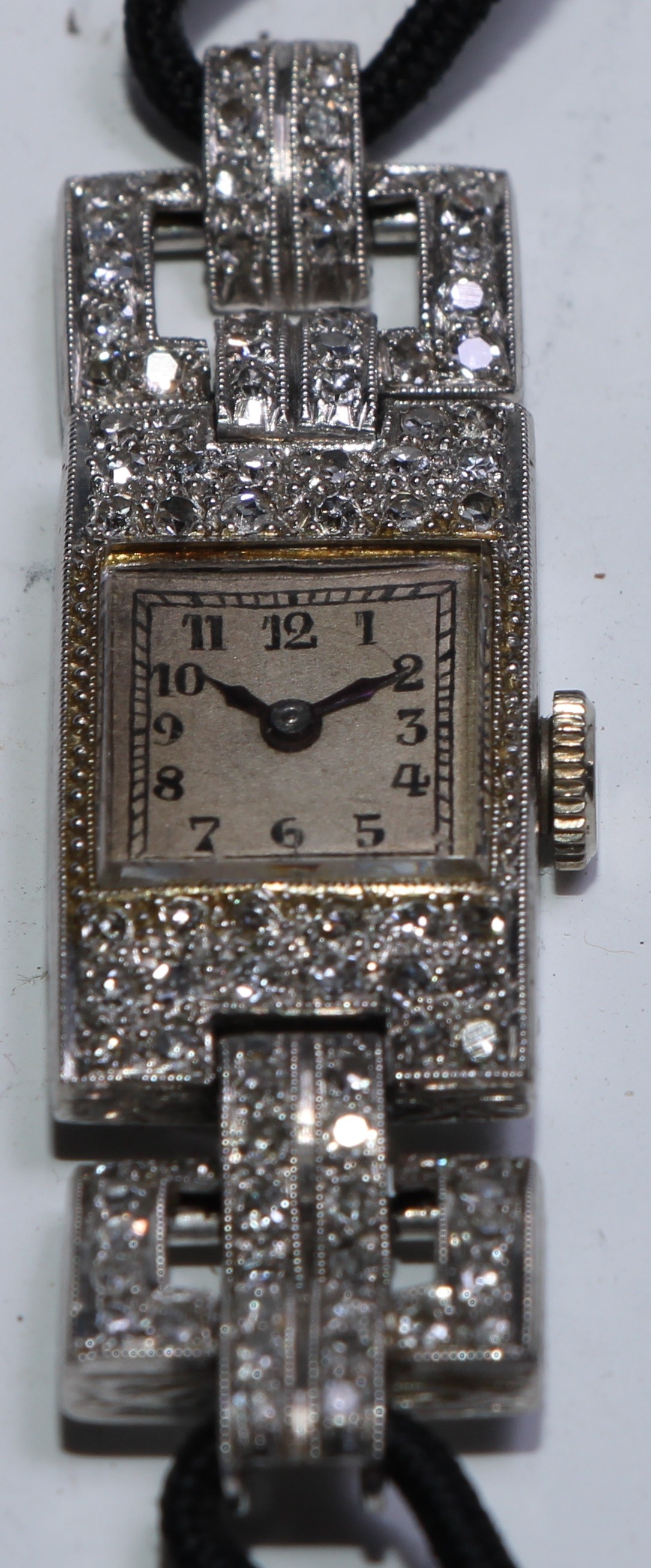 An Art Deco diamond encrusted cocktail watch, square silvered dial, Arabic numerals, blues hands, - Bild 2 aus 2