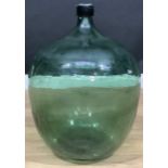 A large free blown green glass carboy, approx. 60cm high, late 19th/early 20th century