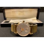 A Garrard hallmarked 9ct gold wristwatch, original box and papers