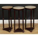 A set of three marble topped occasional tables, 66cm high, 30cm diameter (3)