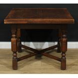 An early 20th century oak drawer-leaf dining table, octagonal panelled baluster legs, 74cm high,