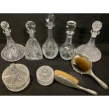 A George V silver hand mirror and brush set, Birmingham 1922; a cut glass ship's decanter; other