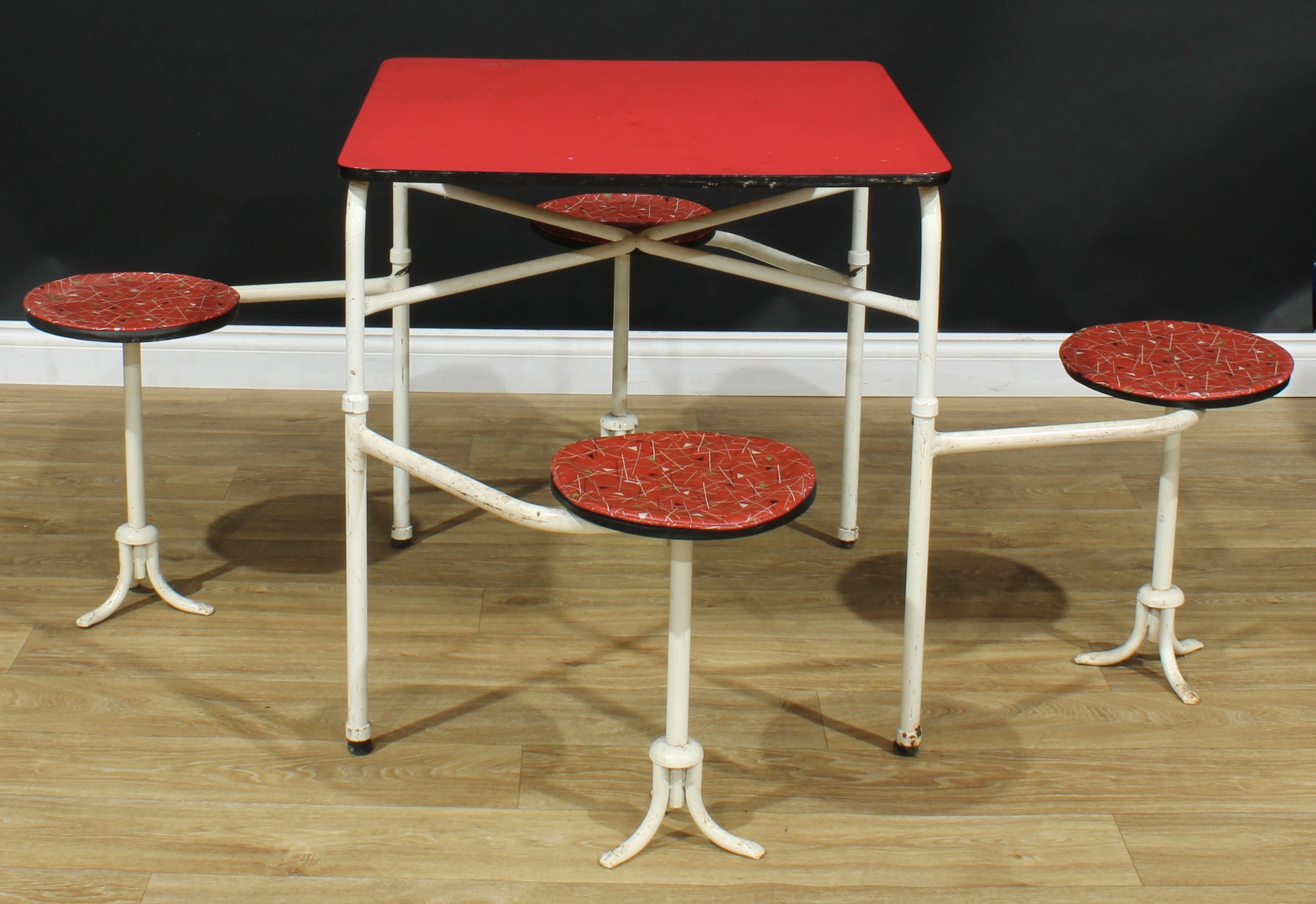 A retro mid-20th century tubular metal framed diner or bistro banqueting table, integral swivel-