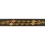 An Yves Saint Laurent gilt metal necklace or belt, set with polished glass stones, marked YSL,