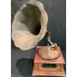 A reproduction HMV horned gramophone