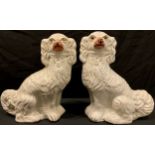 A pair of Victorian Staffordshire Spaniel mantel dogs, 30cm high
