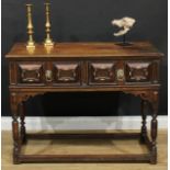 A Charles II style oak side table or serving table, rectangular top with moulded edge above two