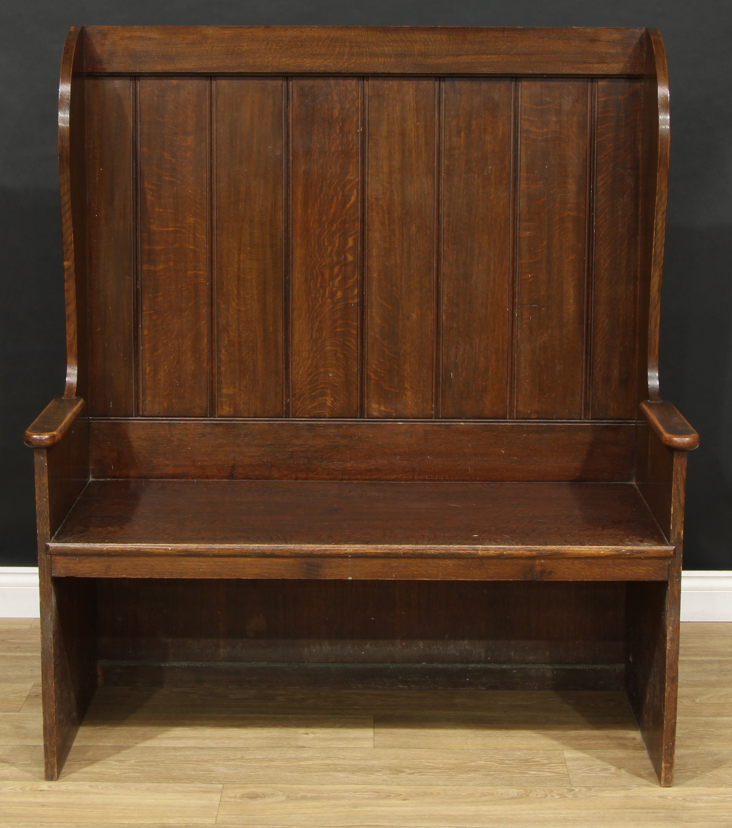 An oak double-width lambing chair or wingback settle, 137.5cm high, 120.5cm wide, 53cm deep, the