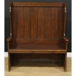 An oak double-width lambing chair or wingback settle, 137.5cm high, 120.5cm wide, 53cm deep, the
