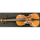 A violin, the two-piece back 35.5cm long excluding button, paper label printed Nicolaus Amatus fecit
