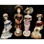 Studio Pottery - a set of four Kathleen Fisher figures, as Victorian ladies dressed in seasonal