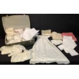 A lace edged christening gown, three others; assorted linen and textiles, tablecloths, etc