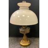 A Victorian Harrods Messenger Stores brass and clear glass oil lamp, opaque glass shade, 54cm high