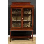 An Edwardian satinwood banded mahogany display cabinet, rectangular top with half gallery above a