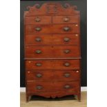 A 19th century mahogany chest on chest, possibly Channel Islands, shaped cresting above two short