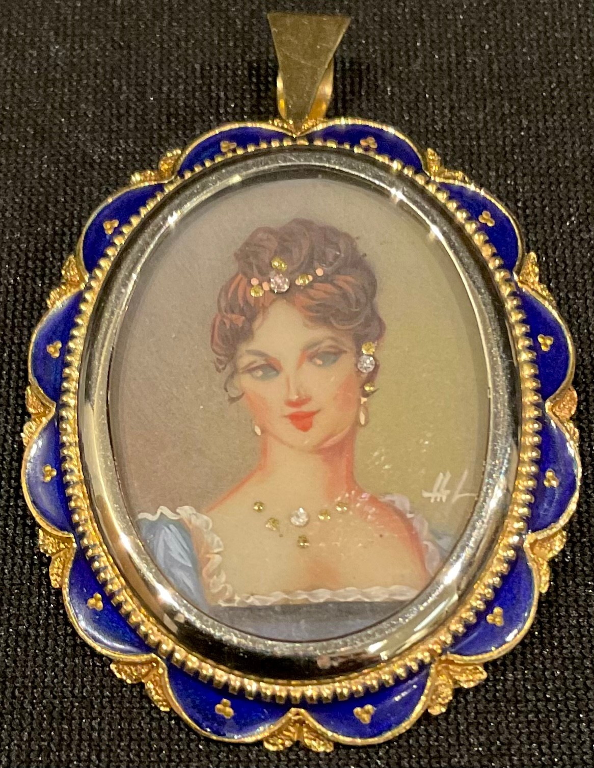 An Italian 18ct gold oval portrait brooch, painted with a beauty, the mount applied with blue