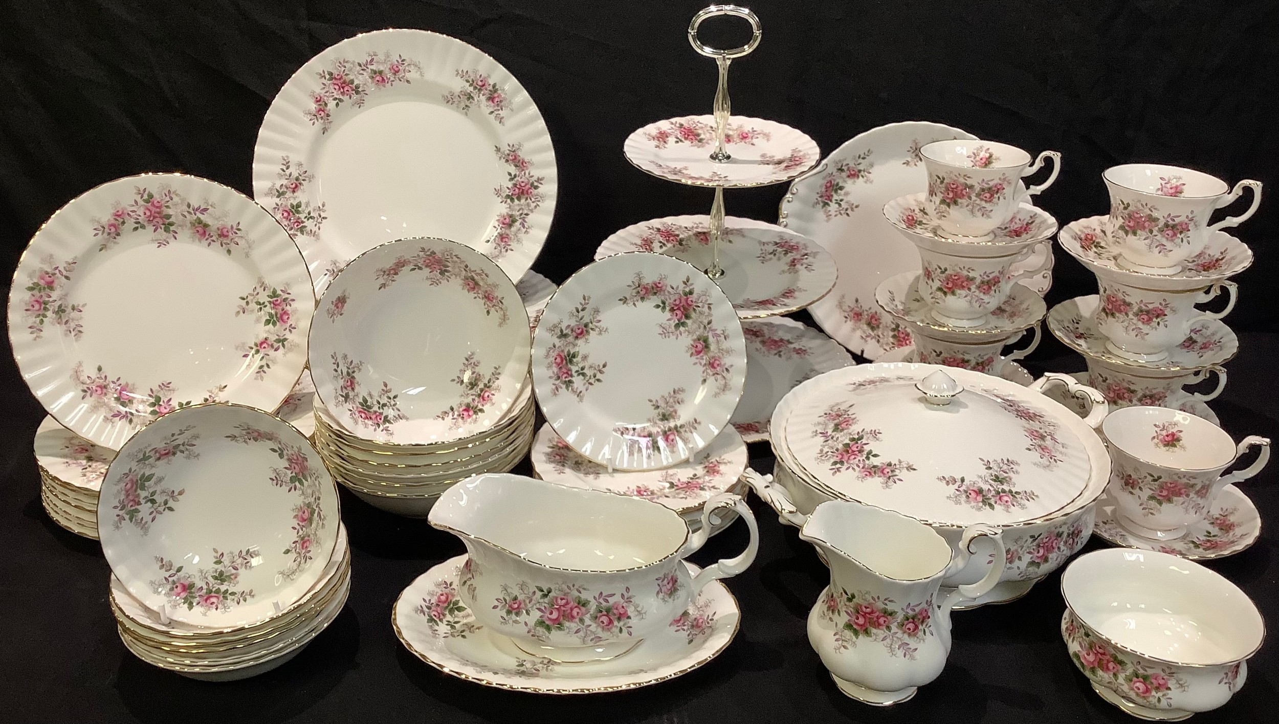 A Royal Albert Lavender Rose pattern dinner and tea service, comprising cake plate, three tier