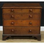 A George III oak chest, of small proportions, moulded top above four long graduated drawers,