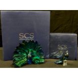 An Swarovski Crystal SCS model, Peacock Arya, dated 2015, boxed, certificate; an SCS complimentary