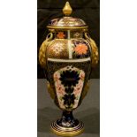 A Royal Crown Derby Imari palette 1128 pattern pedestal vase and cover, the domed cover with spire