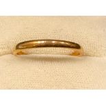 A 22ct gold wedding band, size N, 2.46g