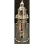 A reproduction Art Deco style silver plated cocktail shaker as a lighthouse, 35cm high