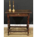 An 18th century design oak side table, oversailing top above a long frieze drawer, turned
