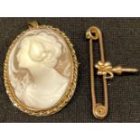 A 9ct gold mounted oval carved shell cameo brooch/pendant, decorated with a beauty in profile, 4cm