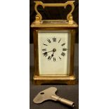 A French lacquered brass five glass carriage clock, white enamel dial with Roman numerals, swing