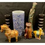 A Chinese ceramic model of an Imperial Horse, 23cm; a Chinese blue and white stick stand; a