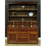 A 19th century oak and mahogany country house dresser, moulded cornice above a pair of plate