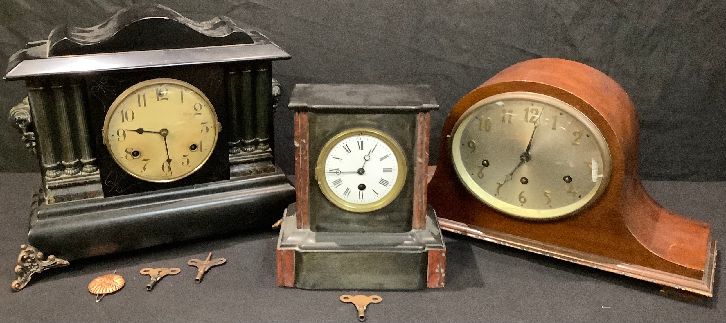 An American mantel clock; a mahogany Napoleon hat mantel clock; a French black slate and rouge