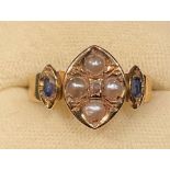 A Victorian 18ct gold ring, the central lozenge set with a single old cut diamond chip, flanked by