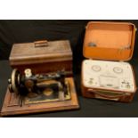 A Ferguson reel-to-reel recorder; a Singer manual sewing machine, wooden carry case (2)