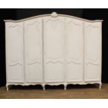 A large contemporary Louis XV inspired quintuple wardrobe or armoire, 206cm high, 260cm wide, 60.5cm