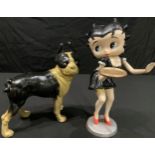 A painted cast iron figure of Betty Boop as a waitress, 31cm high; a painted cast iron model of a