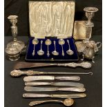 Silver - a cased set of six apostle tea spoons, Birmingham, 1908; silver hafted butter knives;