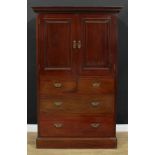 A late Victorian/Edwardian mahogany press cabinet, moulded cornice above a pair of panel doors and